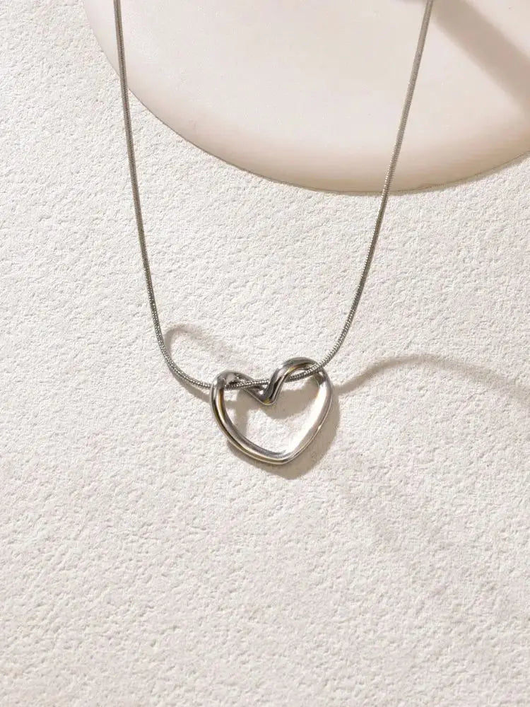 L40 titanium steel hollow heart necklace for women with a light luxury design, heart