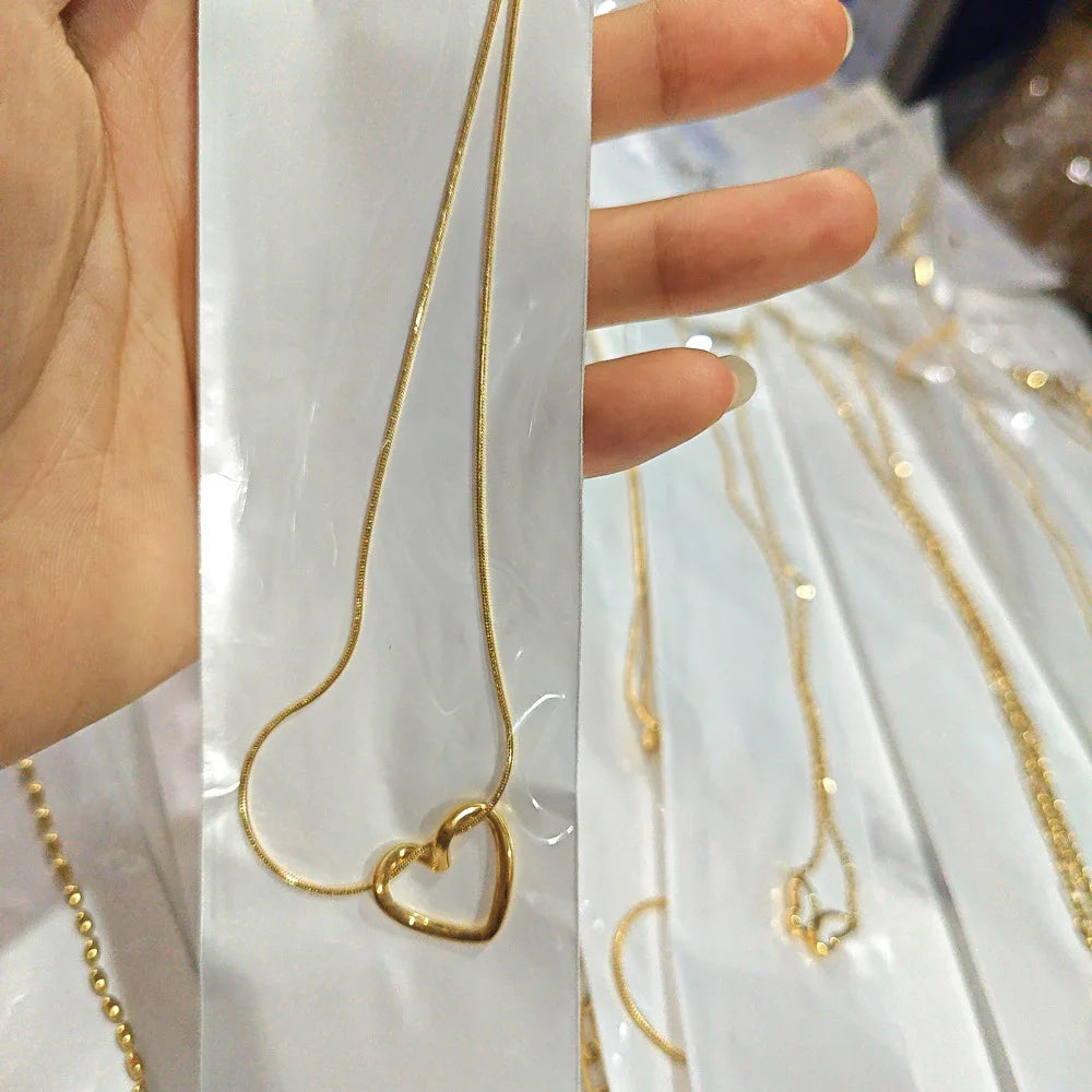 L40 titanium steel hollow heart necklace for women with a light luxury design, heart